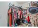 Walk-in closet with metal shelving, hanging rods, and space for storage, clothing, and accessories at 19375 Water Oak Dr # 106, Port Charlotte, FL 33948