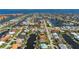 Aerial view of a waterfront community with direct gulf access and a canal behind the home at 211 Lido Dr, Punta Gorda, FL 33950