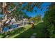 Home's outdoor area features a grassy lawn leading to a boat dock along the canal at 211 Lido Dr, Punta Gorda, FL 33950