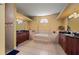 Spacious bathroom featuring dual vanities, a central soaking tub, and ample counter space at 211 Lido Dr, Punta Gorda, FL 33950