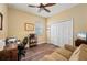 Bedroom features a closet, ceiling fan, a desk and comfortable seating and decor at 211 Lido Dr, Punta Gorda, FL 33950