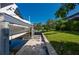 A waterfront property featuring a private boat dock and lift alongside lush green landscaping at 211 Lido Dr, Punta Gorda, FL 33950
