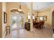 Grand entrance with decorative tile floors, an arched doorway, and dining area on right at 211 Lido Dr, Punta Gorda, FL 33950