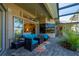 An inviting outdoor seating area extends from sliding glass doors to a private screened lanai at 211 Lido Dr, Punta Gorda, FL 33950
