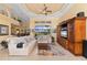Open living room with tile floors, ceiling fan, and a comfortable white sofa at 211 Lido Dr, Punta Gorda, FL 33950