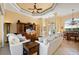 Spacious living area with tile floors, ceiling fan, and a view into the dining area at 211 Lido Dr, Punta Gorda, FL 33950