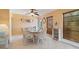 Bright dining room with tile floors, seating for six, and lots of natural light at 21444 Higgs Dr, Port Charlotte, FL 33952