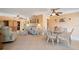 Bright living room and dining area combo with tile floors and lots of natural light at 21444 Higgs Dr, Port Charlotte, FL 33952