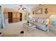 Comfortable living room with flamingo pillows, tile floors, and lots of natural light at 21444 Higgs Dr, Port Charlotte, FL 33952