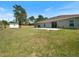 Spacious backyard with a shed, patio, and a partial view of the home's exterior at 22010 Seyburn Ter, Port Charlotte, FL 33954