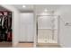 Clean bathroom features a modern glass-enclosed shower and convenient access to a walk-in closet for easy organization at 22010 Seyburn Ter, Port Charlotte, FL 33954