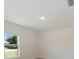 Bedroom features light hardwood floors, one window that provides lots of natural light, and white walls at 22010 Seyburn Ter, Port Charlotte, FL 33954