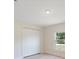 Bedroom features hardwood floors, one window that provides lots of natural light, and a large closet at 22010 Seyburn Ter, Port Charlotte, FL 33954