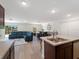 Bright open-concept layout shows seamless flow between the kitchen, dining, and living areas, ideal for gatherings at 22010 Seyburn Ter, Port Charlotte, FL 33954