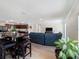 Open-concept living area, bar seating, and modern furniture, seamlessly blending comfort and style at 22010 Seyburn Ter, Port Charlotte, FL 33954