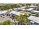 Upper aerial view of building with parking and landscaping, conveniently located near neighborhood businesses at 22375 Edgewater Dr # 255, Punta Gorda, FL 33980