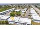 Aerial view shows well maintained building and the community's ample parking and bocce ball court at 22375 Edgewater Dr # 255, Punta Gorda, FL 33980
