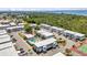 The community features a pool, tennis court, bocce ball, landscaping, and parking near a wooded area and waterway at 22375 Edgewater Dr # 255, Punta Gorda, FL 33980