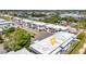 Upper aerial view of buildings with ample parking and landscaping, conveniently located near neighborhood businesses at 22375 Edgewater Dr # 255, Punta Gorda, FL 33980