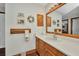Bathroom featuring a large vanity and sink, alongside decorative wall art at 22375 Edgewater Dr # 255, Punta Gorda, FL 33980