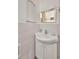This bathroom's sink includes a cabinet below and is accompanied by a small mirror and a medicine cabinet at 22375 Edgewater Dr # 255, Punta Gorda, FL 33980