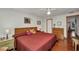 Spacious bedroom features hardwood floors, a dresser, and art pieces hanging on the walls at 22375 Edgewater Dr # 255, Punta Gorda, FL 33980
