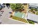 Aerial view of the bocce ball court and landscaping with nearby parking and seating for the condo community at 22375 Edgewater Dr # 255, Punta Gorda, FL 33980