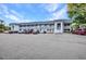 Well-maintained condo building exterior with ample parking and a sunny sky at 22375 Edgewater Dr # 255, Punta Gorda, FL 33980