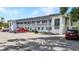 Exterior view of well-maintained building; each unit features its own private balcony and nearby parking at 22375 Edgewater Dr # 255, Punta Gorda, FL 33980