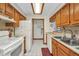 Classic kitchen with oak cabinets, white appliances, and plenty of counter space at 22375 Edgewater Dr # 255, Punta Gorda, FL 33980
