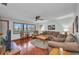Cozy living room with hardwood floors, comfortable furniture, and bright windows at 22375 Edgewater Dr # 255, Punta Gorda, FL 33980