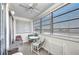 Bright sunroom features a ceiling fan and several windows that provide great natural light at 22375 Edgewater Dr # 255, Punta Gorda, FL 33980