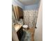 Bathroom with vanity and shower-tub combo at 2306 Lee Ter, Port Charlotte, FL 33952