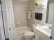 Cozy bathroom featuring a tub and shower combo, complete with floral accents and a functional layout at 24141 Green Heron Dr # 23, Punta Gorda, FL 33980