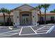 Well-appointed clubhouse entrance with beautiful double-doors and landscaping at 24141 Green Heron Dr # 23, Punta Gorda, FL 33980