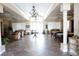 Spacious clubhouse with elegant decor, tile flooring, and ample seating at 24141 Green Heron Dr # 23, Punta Gorda, FL 33980