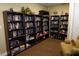 Community library room featuring extensive bookshelves filled with books and board games and a cozy armchair at 24141 Green Heron Dr # 23, Punta Gorda, FL 33980