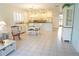 Open concept living and dining area with tile flooring, seamlessly connecting to the kitchen for easy entertaining at 24141 Green Heron Dr # 23, Punta Gorda, FL 33980