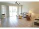 Bright living room with tile floors, neutral-colored walls and furnishings at 24141 Green Heron Dr # 23, Punta Gorda, FL 33980