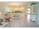 Open-concept living area with view of kitchen and dining space at 24141 Green Heron Dr # 23, Punta Gorda, FL 33980