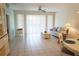 Bright living room with tile floors, neutral-colored walls and furnishings at 24141 Green Heron Dr # 23, Punta Gorda, FL 33980