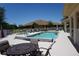 Backyard swimming pool and patio area with outdoor furniture, perfect for relaxation at 24141 Green Heron Dr # 23, Punta Gorda, FL 33980