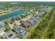 Aerial view of the homes in a lake community showing large houses and numerous private swimming pools at 2427 Carnation Ct, North Port, FL 34289