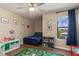bedroom with window, ceiling fan, and themed decor at 2427 Carnation Ct, North Port, FL 34289