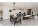 Open dining area with modern lighting and stylish wood flooring, perfect for entertaining at 2427 Carnation Ct, North Port, FL 34289
