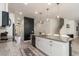 Spacious kitchen features granite countertops, white cabinets, a center island, and stylish pendant lighting at 2427 Carnation Ct, North Port, FL 34289