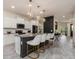 Beautiful kitchen with a granite island, white cabinets, and stainless steel appliances; perfect for entertaining at 2427 Carnation Ct, North Port, FL 34289