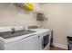 A laundry room with a washer and dryer at 2427 Carnation Ct, North Port, FL 34289