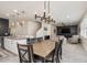 Open-concept living area with modern finishes and a seamless flow to the kitchen and dining spaces at 2427 Carnation Ct, North Port, FL 34289