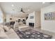 Spacious living room with large area rug, stylish furnishings, and plenty of natural light at 2427 Carnation Ct, North Port, FL 34289